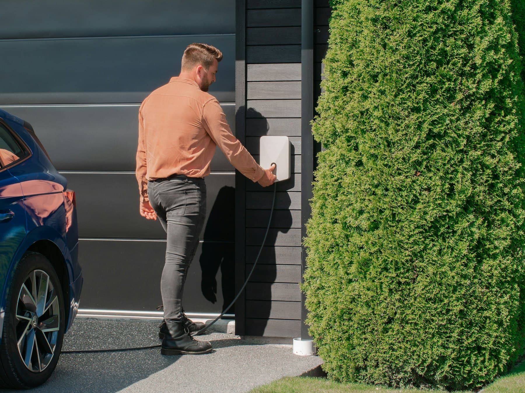 Home electric vehicle charge point mounted on an exterior wall